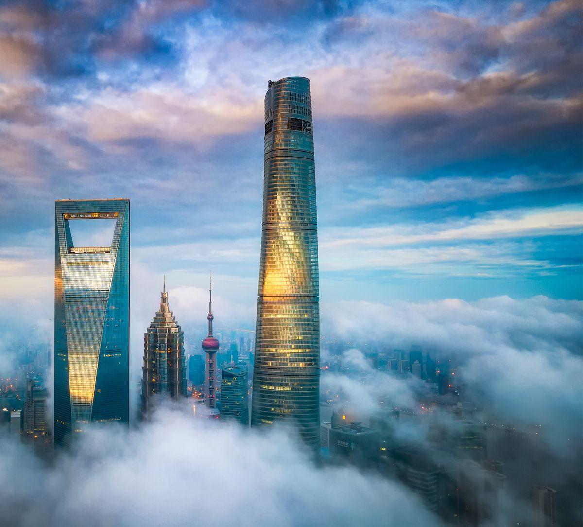 Check out this hotel - said to be the highest in the world. The J hotel is on the top floors of the 632-metre (more than 2,000 feet) Shanghai Tower in the city's financial district, the second-tallest building in the world after Dubai's Burj Khalifa. It features elevators which take guests to the top at 18 metres per second, and a restaurant on the 120th floor and 24-hour butler service. The 165-room hotel has seven restaurants, bars, a spa, an 84th-floor swimming pool, and other luxuries. The hotel is part of Jin Jiang International Hotels. 29 Jun 2021 Pictured: Exterior of J Hotel. Photo credit: Courtesy of J Hotel/MEGA TheMegaAgency.com +1 888 505 6342